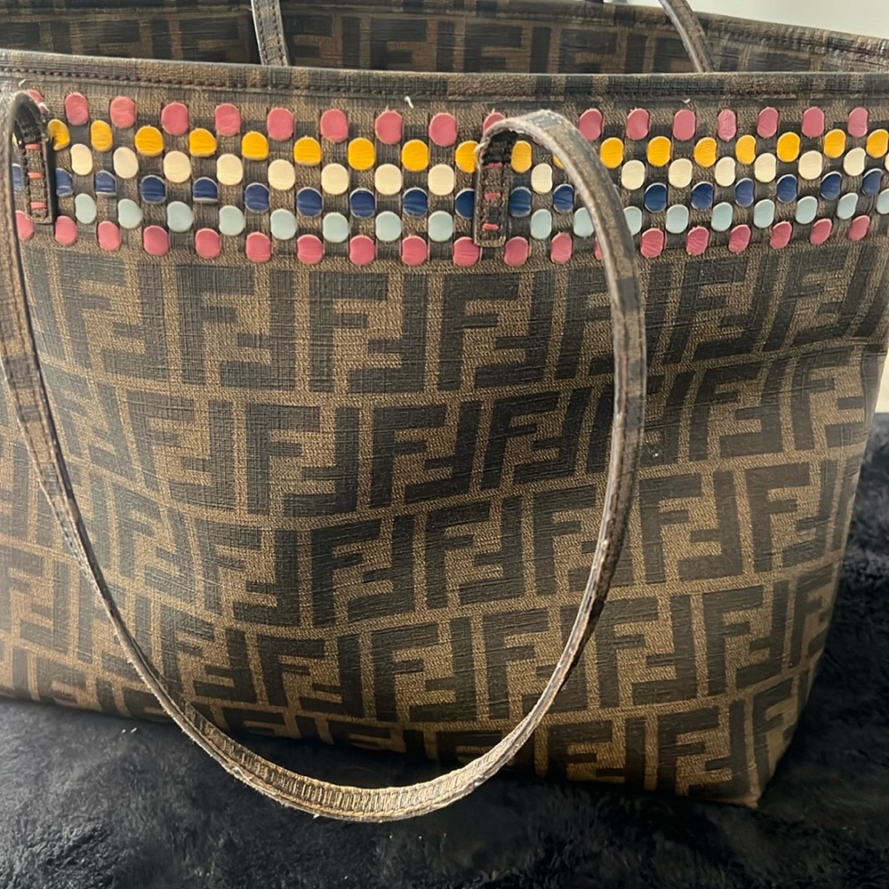 Brown and multi color accent. Purple interior also excellent condition.